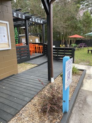 Nice seating on the deck with pergola, or tables on the lawn.  at Naked Vegan in Greenville