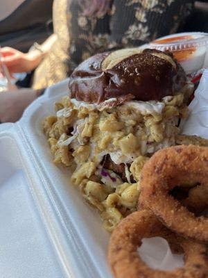 Atlas Monroe Mac & Cheeze Chick’n Sandwich (fried Chick’n, slaw, mac, pickles, and sauce of choice with pretzel bun)  at Naked Vegan in Greenville
