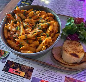 Zeze's Pasta with garlic bread at Jungle Street Kitchen in Lichfield