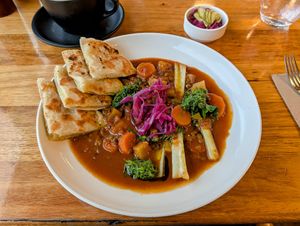 Spiced lentils casserole with potato bread and extra pickles. 22 June 2025. at Grain of the Silos in Invermay