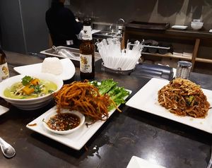 Kabocha squash fritter, vegan Pad Thai, and tofu vegetable green curry with white rice, with Singha beers. at Khao San Road in Toronto