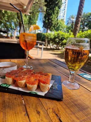 Pan con tomate, estrella, and aperol spritz at Amarre Marina in Barcelona