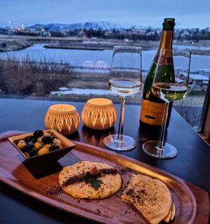 The view is spectacular. So why not sit back, relax, enjoy and sip on a beautiful bottle of wine with some snacks.  at Sono Matseljur in Reykjavik