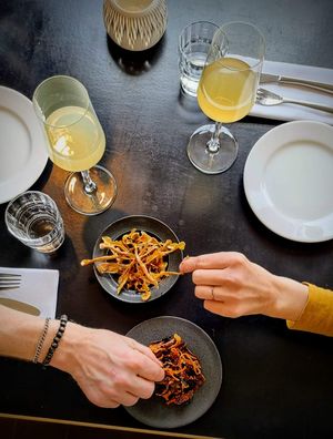 Our kitchen throws noting unnecessary away. Here you see the peels made into beautiful pre dinner snacks.  at Sono Matseljur in Reykjavik