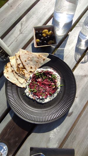 Flatbread, beetroot hummus, vegan mayo, Nigella seeds. at Sono Matseljur in Reykjavik