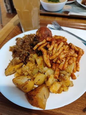 Potatoes with pasta. On the side is cabbage and kofta with tomato sauce at Vega in Warsaw
