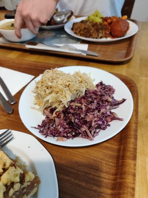 Celery salad with apples, red cabbage salad with apples at Vega in Warsaw