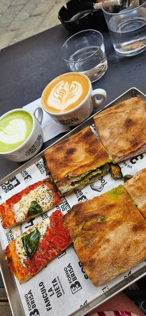 Margerita slice, matcha and cappuchino with oatmilk, melanzana and a proscuitto sandwich at Forno Brisa - Via Castiglione in Bologna