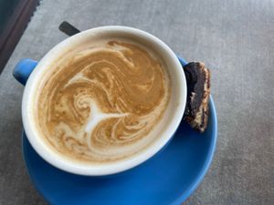 Soy flat white with biscuit   at Ninna's Kitchen in Brighton