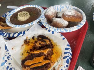 hot sausage, red beans and rice, and vegan beignets  at Meals From The Heart Cafe in New Orleans