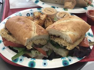 Vegan crab cake po’boy with potatoes at Meals From The Heart Cafe in New Orleans