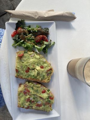 Avocado toast and latte with almond milk  at Brusco in Santorini