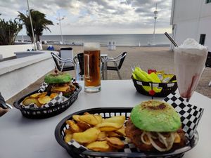 Burgers, beer and cheesecake milkshake (already ate all the onion rings so no photo of those) at El Gecko Veggie in Lanzarote