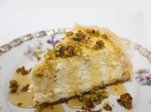 Pistachios, pecans, almonds,  cardamom,  and a creamy honey cheesecake filling, topped with a baklava layer, soaked in honey syrup. The best dessert you’ve ever had! at Habibi Kush in Miami