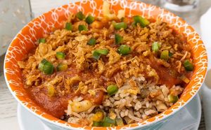 Koshery -One of the most traditional dishes for any meal in Egypt. Rice, lentils, pasta, and onions are layered and covered in tomato sauce, topped with fried onions at Habibi Kush in Miami
