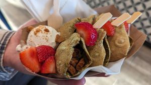 MATCHA TOKYO-TEA-TIME - MATCHA FLAVOR WITH BISCOFF AND BISCOFF CRUNCH FILLING, TOPPED WITH STRAWBERRY JAM, BISCOFF CRUNCH AND STRAWBERRIES. at Poffy in Vienna