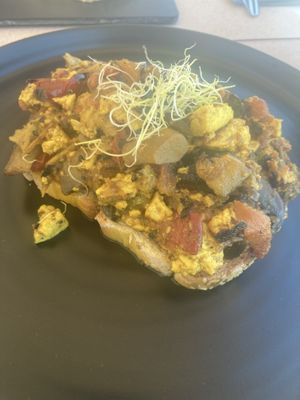 Tofu scramble ( more like a shakshuka(?)) lots of veg , quite oily but I like that ! Lovely seeded bread   at Come Back in Naoussa