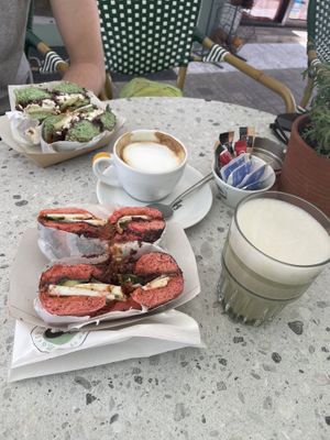Red vegan greek bagel with matcha latte, flat white with (vegetarian) green greek bagel  at Merry Berry in Thessaloniki