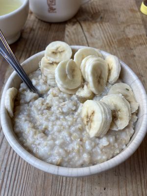 Oatmeal with bananas. Oat milk available as well as other fruits, maple syrup and nuts   at Le Pain Quotidien - 44th and 3rd in New York City
