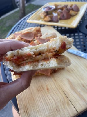 Close-Up of Vegan Hawaiian Pizza (Folded) 😛  at The Grain Cafe in Van Nuys