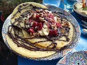 Marokkaanse pannenkoeken met chocolade, room, aardbeien en walnoten at DAR Restaurant & Cocktail Bar in Zurich