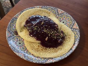 Honeycomb shaped pancakes with fruit compote and chai custard  at DAR Restaurant & Cocktail Bar in Zurich
