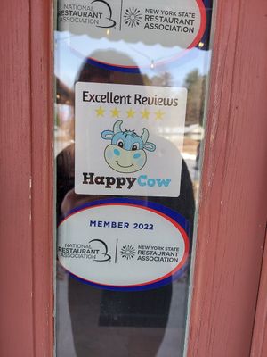 Front entrance sign for HappyCow at Trail Break in Schroon Lake