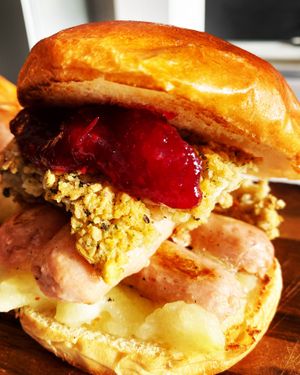 Xmas special double sausage ,sage and onion stuffing, homemade cranberry sauce in a vegan brioche Bun  at Greedy Vegan in Chelmsford