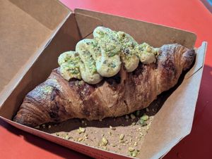 Raspberry croissant filled with pistachio cream! at Turlaj Klopsa - Karmelicka in Krakow