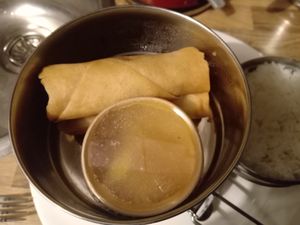 From the Vietnamese curry menu: 'Spring rolls with fried tofu and leek' and 'sauce of pickled plums and apricots' at Dabba Dinner in Nijmegen