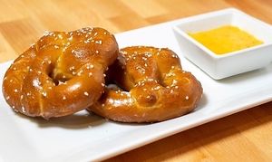 Vegan soft, butter pretzels with maple mustard sauce of beer cheese dip at Coco Bistro & Bar in Chapel Hill