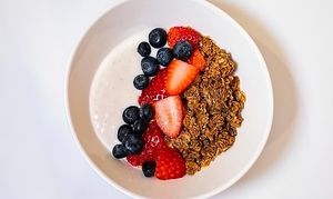 Organic gluten-free granola with cashew milk yogurt and fresh-cut fruit at Coco Bistro & Bar in Chapel Hill