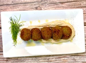 Vegan Falafel on housemade hummus  at Coco Bistro & Bar in Chapel Hill