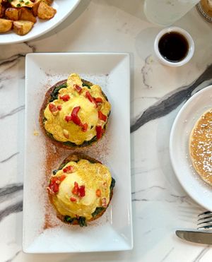 Pesto Florentine - Plant-Based Yo Eggs and vegan hollaindaise sauce at Coco Bistro & Bar in Chapel Hill