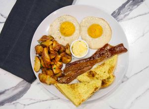 All Plant-Based, All-American Breakfast: Sunny Side Up Eggs, Umaro Bacon, Housemade Brioche Bread and Breakfast Potatoes at Coco Bistro & Bar in Chapel Hill