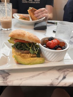 Complete breakfast sandwich, comes with fruit   at Coco Bistro & Bar in Chapel Hill