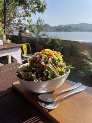 The buddha bowl with warm, delicious baked greens and homemade hummus at the buttom.   at Vegan Way in Pokhara