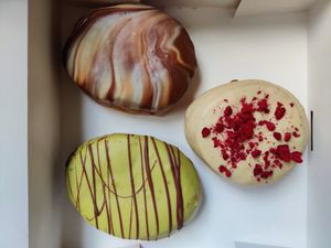 Chocolate and caramel, matcha and berries and white chocolate at Bungnuts vegan Doughnuts. in Barcelona