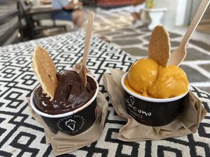 Mango and Dark chocolate. We didn’t eat the wafers because they aren’t vegan    at DaVinci Gelato in Mykonos