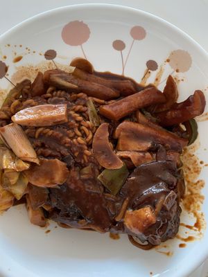 Black bean tteokbokki with all the added extras!  at Cow Tteokbokki  in Seoul