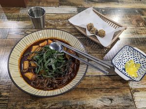 Vegan jajang noodles tteobokki (with pumpkin (squash) added) and (1 order of) glass noodles in seaweed at Cow Tteokbokki  in Seoul