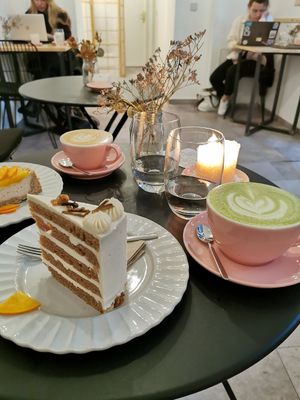Matcha latte, flat white, vanilla Chai cake. at Sakura in Berlin