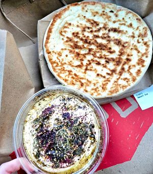 Side of pita and hummus. Definitely add another piece of pita, it wasn't enough. at Shouk in Rockville