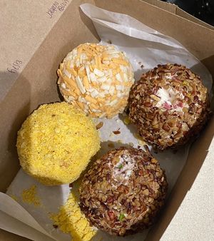 Cheese ball flight! I believe from the top going clockwise it was fiesta dip, jalapeño bacon, bourbon cranberry, and sun-dried tomato.  at The Mindful Table in Perrysburg