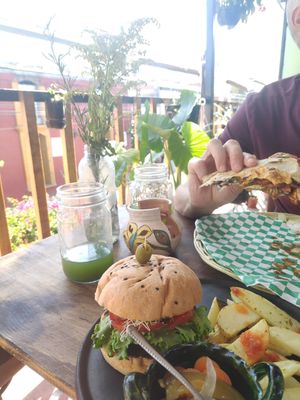 Burger and Tlayuda at Los Muchitos Comida Vegana in Oaxaca