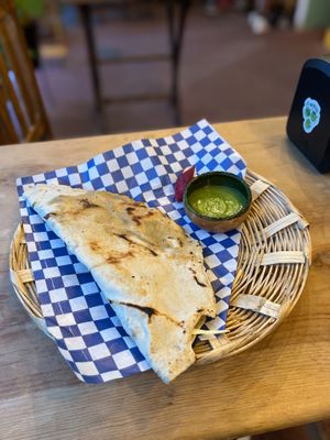 Picture doesn’t show scale, but a very large tlayuda de setas with a delicious dipping sauce  at Los Muchitos Comida Vegana in Oaxaca