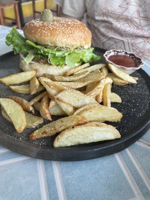 Lentil burger with fries  at Los Muchitos Comida Vegana in Oaxaca