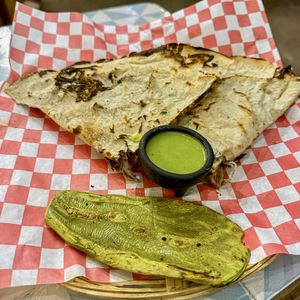Tlayuda with pastor  at Los Muchitos Comida Vegana in Oaxaca