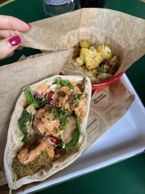 Pita with falafel, vegan dressing, roasted cauliflower side  at Barouche in Ghent