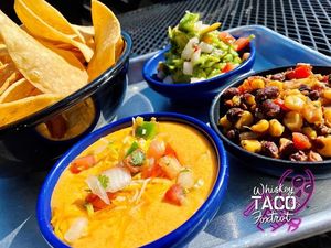 Homemade Guacamole,  black bean corn salsa, queso.  Hand cut chips at Whiskey Taco Foxtrot in Clawson